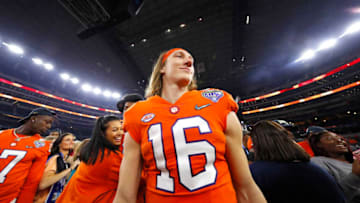 ARLINGTON, TEXAS - DECEMBER 29: Trevor Lawrence #16 of the Clemson Tigers celebrates after defeating the Notre Dame Fighting Irish during the College Football Playoff Semifinal Goodyear Cotton Bowl Classic at AT&T Stadium on December 29, 2018 in Arlington, Texas. Clemson defeated Notre Dame 30-3. (Photo by Tom Pennington/Getty Images)