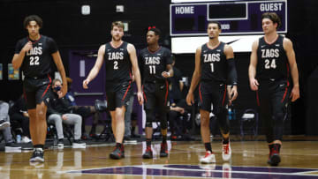 PORTLAND, OREGON - JANUARY 09: Anton Watson #22, Drew Timme #2, Joel Ayayi #11, Jalen Suggs #1, Corey Kispert #24 of the Gonzaga Bulldogs walk back to the court after a timeout during the first half against the Portland Pilots at Chiles Center on January 09, 2021 in Portland, Oregon. (Photo by Soobum Im/Getty Images)
