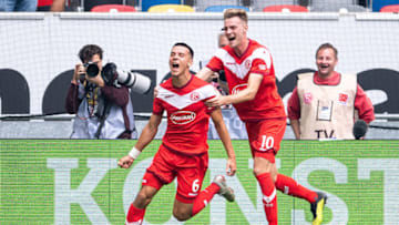 15 September 2018, North Rhine-Westphalia, Duesseldorf: 15 September 2018, Germany, Duesseldorf: Football, Bundesliga, Fortuna Duesseldorf vs 1899 Hoffenheim, 3rd day of play in the Merkur Spiel-Arena. Duesseldorf scorer Alfredo Morales (L) and Marvin Ducksch cheer after the goal to lead 1-0. Photo: Marius Becker/dpa - IMPORTANT NOTICE: DFL an d DFB regulations prohibit any use of photographs as image sequences and/or quasi-video. (Photo by Marius Becker/picture alliance via Getty Images)