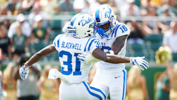 WACO, TX - SEPTEMBER 15: Dylan Singleton #16 of the Duke Blue Devils celebrates after recovering a fumble with teammate Josh Blackwell #31 against the Baylor Bears during the first half of a football game at McLane Stadium on September 15, 2018 in Waco, Texas. (Photo by Cooper Neill/Getty Images)