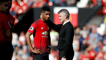 Manchester United caretaker manager Ole Gunnar Solskjaer (right) with Marcus Rashford after the final whistle during the Premier League match at Old Trafford, Manchester. (Photo by Martin Rickett/PA Images via Getty Images)