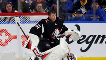 Mar 4, 2023; Buffalo, New York, USA; Buffalo Sabres goaltender Eric Comrie (31) looses his helmet during the pay in the second period against the Tampa Bay Lightning at KeyBank Center. Mandatory Credit: Timothy T. Ludwig-USA TODAY Sports