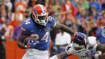Nov 22, 2014; Gainesville, FL, USA; Florida Gators running back Matt Jones (24) runs past Eastern Kentucky Colonels linebacker Trey Thomas (24) during the first quarter at Ben Hill Griffin Stadium. Mandatory Credit: Kim Klement-USA TODAY Sports