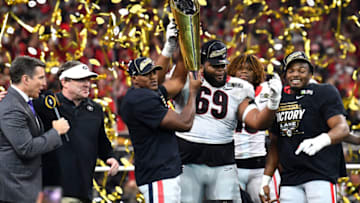 Georgia Bulldogs players celebrate after the Georgia Bulldogs defeated the Alabama Crimson Tide 33-18 in the 2022 CFP National Championship Game at Lucas Oil Stadium on January 10, 2022 in Indianapolis, Indiana. (Photo by Emilee Chinn/Getty Images)