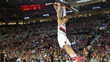 Nov 11, 2015; Portland, OR, USA; Portland Trail Blazers forward Meyers Leonard (11) hangs on the rim before the start of the game against the San Antonio Spurs at the Moda Center. Mandatory Credit: Craig Mitchelldyer-USA TODAY Sports