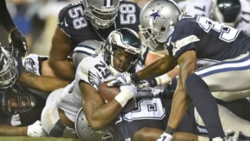 Sep 20, 2015; Philadelphia, PA, USA; Philadelphia Eagles running back DeMarco Murray looks at the line judge as Dallas Cowboys defensive tackle Jack Crawford tackles him in the fourth quarter at Lincoln Financial Field. Mandatory Credit: James Lang-USA TODAY Sports