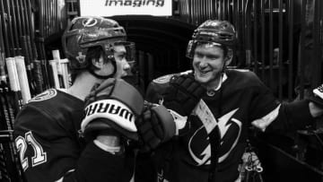 TAMPA, FL - APRIL 14: Brayden Point #21 and Ondrej Palat #18 of the Tampa Bay Lightning watch the final seconds of the game from the hallway to the lockeroom during the third period against the New Jersey Devils in Game Two of the Eastern Conference First Round during the 2018 NHL Stanley Cup Playoffs at Amalie Arena on April 14, 2018 in Tampa, Florida. (Photo by Scott Audette/NHLI via Getty Images)