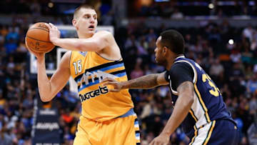 Apr 10, 2016; Denver, CO, USA; Utah Jazz forward Trevor Booker (33) guards Denver Nuggets center Nikola Jokic (15) in the third quarter at the Pepsi Center. The Jazz defeated the Nuggets 100-84. Mandatory Credit: Isaiah J. Downing-USA TODAY Sports