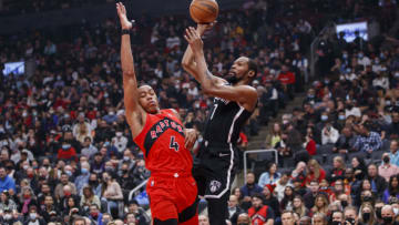 TORONTO, ON - NOVEMBER 07: Kevin Durant #7 of the Brooklyn Nets puts up a shot over Scottie Barnes #4 of the Toronto Raptors during the first half of their NBA game at Scotiabank Arena on November 7, 2021 in Toronto, Canada. NOTE TO USER: User expressly acknowledges and agrees that, by downloading and or using this Photograph, user is consenting to the terms and conditions of the Getty Images License Agreement. (Photo by Cole Burston/Getty Images)