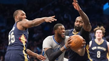 Apr 3, 2016; Brooklyn, NY, USA;Brooklyn Nets forward Willie Reed (33) guarded by New Orleans Pelicans guard Jordan Hamilton (25) and New Orleans Pelicans center Kendrick Perkins (5) in the second half at Barclays Center. Pelicans defeat the Nets 106-87. Mandatory Credit: William Hauser-USA TODAY Sports