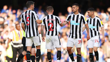 LONDON, ENGLAND - MAY 28: Bruno Guimaraes of Newcastle United embraces teammates after the draw during the Premier League match between Chelsea FC and Newcastle United at Stamford Bridge on May 28, 2023 in London, England. (Photo by Warren Little/Getty Images)