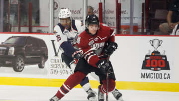 WINDSOR, ON - SEPTEMBER 24: Defenceman Ryan Merkley #6 of the Guelph Storm moves the puck against Cole Purboo #26 of the Windsor Spitfires on September 24, 2017 at the WFCU Centre in Windsor, Ontario, Canada. (Photo by Dennis Pajot/Getty Images)