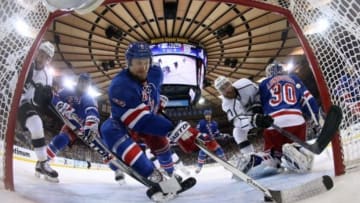Jun 11, 2014; New York, NY, USA; New York Rangers defenseman Anton Stralman (6) clears the puck from off the goal line away from goalie Henrik Lundqvist (30) and Los Angeles Kings center Jeff Carter (77) during the first period in game four of the 2014 Stanley Cup Final at Madison Square Garden. Mandatory Credit: Bruce Bennett/Pool Photo via USA TODAY Sports