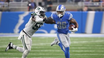 Dwayne Washington #36 of the Detroit Lions runs for a first down as Demario Davis #56 of the New York Jets makes the stop during the second quarter of the preseason on August 19, 2017 at Ford Field in Detroit, Michigan. The Lions defeated the Jets 16-6. (Photo by Leon Halip/Getty Images)