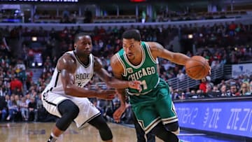 Mar 17, 2016; Chicago, IL, USA; Chicago Bulls guard Derrick Rose (1) drives around Brooklyn Nets guard Donald Sloan (15) during the second half at the United Center. Chicago won 118-102. Mandatory Credit: Dennis Wierzbicki-USA TODAY Sports