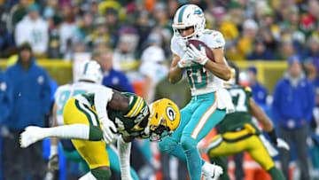 GREEN BAY, WI - NOVEMBER 11: Danny Amendola #80 of the Miami Dolphins makes a catch in front of Josh Jackson #37 of the Green Bay Packers during the first half of a game at Lambeau Field on November 11, 2018 in Green Bay, Wisconsin. (Photo by Stacy Revere/Getty Images)