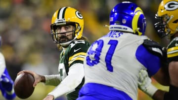 GREEN BAY, WISCONSIN - NOVEMBER 28: Aaron Rodgers #12 of the Green Bay Packers looks to pass the ball against the Los Angeles Rams in the second half at Lambeau Field on November 28, 2021 in Green Bay, Wisconsin. (Photo by Patrick McDermott/Getty Images)