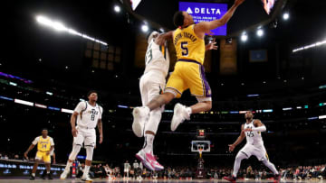 LOS ANGELES, CALIFORNIA - JANUARY 17: Talen Horton-Tucker #5 of the Los Angeles Lakers drives to the basket against Royce O'Neale #23 of the Utah Jazz during the third quarter at Crypto.com Arena on January 17, 2022 in Los Angeles, California. NOTE TO USER: User expressly acknowledges and agrees that, by downloading and/or using this photograph, User is consenting to the terms and conditions of the Getty Images License Agreement. (Photo by Katelyn Mulcahy/Getty Images)