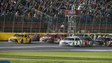 May 21, 2016; Concord, NC, USA; Sprint Cup Series drivers Kyle Busch (75) and Kevin Harvick (4) lead the way down the front stretch after a caution during the Sprint All-Star Race at Charlotte Motor Speedway. Mandatory Credit: Jim Dedmon-USA TODAY Sports