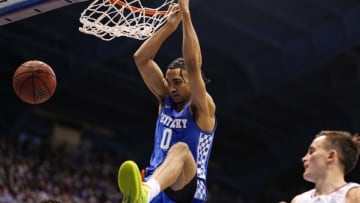 Jan 29, 2022; Lawrence, Kansas, USA; Kentucky Wildcats forward Jacob Toppin (0) dunks the ball against Kansas Jayhawks forward Jalen Wilson (10) and forward Mitch Lightfoot (44) during the first half at Allen Fieldhouse. Mandatory Credit: Jay Biggerstaff-USA TODAY Sports