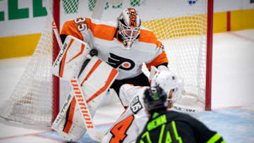 Nov 13, 2021; Dallas, Texas, USA; Philadelphia Flyers goaltender Martin Jones (35) stops a shot by Dallas Stars left wing Jamie Benn (14) during the third period at the American Airlines Center. Mandatory Credit: Jerome Miron-USA TODAY Sports
