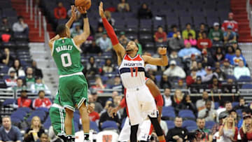 Jan 25, 2016; Washington, DC, USA; Boston Celtics guard Avery Bradley (0) shoots over Washington Wizards guard Garrett Temple (17) during the first half at Verizon Center. Mandatory Credit: Brad Mills-USA TODAY Sports