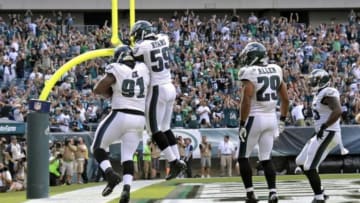 Sep 7, 2014; Philadelphia, PA, USA; Philadelphia Eagles defensive end Fletcher Cox (91) celebrates his 17-yard fumble return for a touchdown with teammates inside linebacker DeMeco Ryans (59), strong safety Nate Allen (29) and linebacker Brandon Graham (55) in the fourth quarter against the Jacksonville Jaguars at Lincoln Financial Field. The Eagles defeated the Jaguars, 34-17. Mandatory Credit: Eric Hartline-USA TODAY Sports