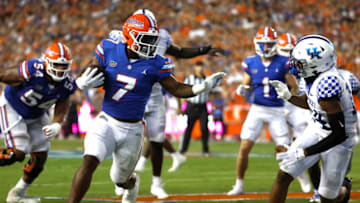 Sep 10, 2022; Gainesville, Florida, USA; Florida Gators running back Trevor Etienne (7) runs with the ball against the Kentucky Wildcats during the first half at Ben Hill Griffin Stadium. Mandatory Credit: Kim Klement-USA TODAY Sports