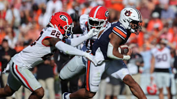 Auburn footballSep 30, 2023; Auburn, Alabama, USA; Georgia Bulldogs defensive back Javon Bullard (22) looks to tackle Auburn Tigers running back Jarquez Hunter (27) during the second quarter at Jordan-Hare Stadium. Mandatory Credit: John Reed-USA TODAY Sports