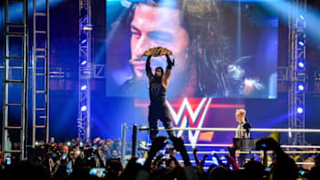 In this photograph taken on January 15, 2016, wrestler Roman Reigns holds up the Championship Belt during the World Wrestling Entertainment (WWE) Live India Tour in New Delhi. Enthusiastic fans flocked to the event as WWE returned to the country after an interval of 13 years. AFP PHOTO/ CHANDAN KHANNA / AFP / Chandan Khanna (Photo credit should read CHANDAN KHANNA/AFP/Getty Images)