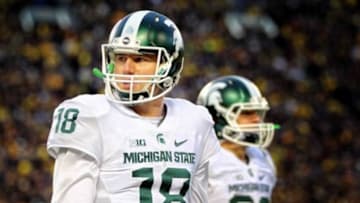 Oct 17, 2015; Ann Arbor, MI, USA; Michigan State Spartans quarterback Connor Cook (18) stands on the field during the 1st quarter of a game against the Michigan Wolverines at Michigan Stadium. Mandatory Credit: Mike Carter-USA TODAY Sports