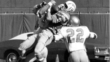 San Diego Chargers wide receiver Lance Alworth (19), inducted into the Pro Football Hall of Fame class of 1978, makes a catch in front of two defenders, including Houston Oilers cornerback Zeke Moore (22) during a 31-31 tie on October 25, 1970, at San Diego Stadium in San Diego, California. (Photo by Charles Aqua Viva/Getty Images)