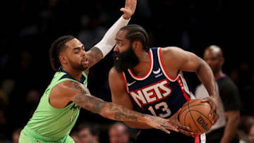 NEW YORK, NEW YORK - DECEMBER 03: James Harden #13 of the Brooklyn Nets tries to get past D'Angelo Russell #0 of the Minnesota Timberwolves in the fourth quarter at Barclays Center on December 03, 2021 in the Brooklyn borough of New York City. The Brooklyn Nets defeated the Minnesota Timberwolves 110-105. NOTE TO USER: User expressly acknowledges and agrees that, by downloading and or using this photograph, User is consenting to the terms and conditions of the Getty Images License Agreement. (Photo by Elsa/Getty Images)