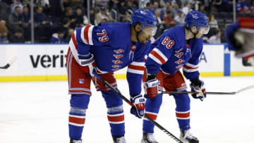 NEW YORK, NEW YORK - MARCH 21: K'Andre Miller #79 and Patrick Kane #88 of the New York Rangers look on during the first period against the Carolina Hurricanes at Madison Square Garden on March 21, 2023 in New York City. (Photo by Sarah Stier/Getty Images)