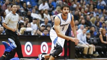 Oct 10, 2014; Minneapolis, MN, USA; Minnesota Timberwolves guard Ricky Rubio (9) steals the ball from Philadelphia 76er forward Brandon Davies (0) in the first quarter at Target Center. The Timberwolves win 116-110. Mandatory Credit: Bruce Kluckhohn-USA TODAY Sports