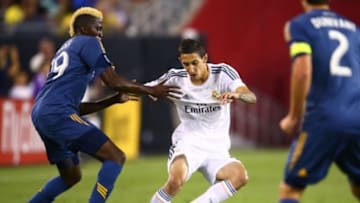 Aug 1, 2013; Glendale, AZ, USA; Real Madrid forward Angel Di Maria (center) against the Los Angeles Galaxy during a friendly match at the University of Phoenix Stadium. Real Madrid defeated the Galaxy 3-1. Mandatory Credit: Mark J. Rebilas-USA TODAY Sports