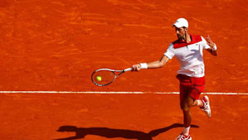 MONTE-CARLO, MONACO - APRIL 19: Novak Djokovic of Serbia in action against Dominic Thiem of Austria during his men's singles match on day five of the Rolex Monte-Carlo Masters at Monte-Carlo Sporting Club on April 19, 2018 in Monte-Carlo, Monaco. (Photo by Julian Finney/Getty Images)