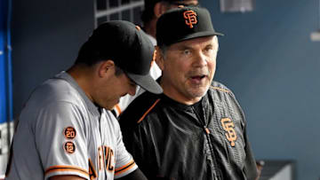 Aug 25, 2016; Los Angeles, CA, USA; San Francisco Giants starting pitcher Matt Moore (45) speaks with manager Bruce Bochy (15) he came up one out short of a no hitter giving up a single to Los Angeles Dodgers shortstop Corey Seager (5) in the ninth inning of the game at Dodger Stadium. Mandatory Credit: Jayne Kamin-Oncea-USA TODAY Sports