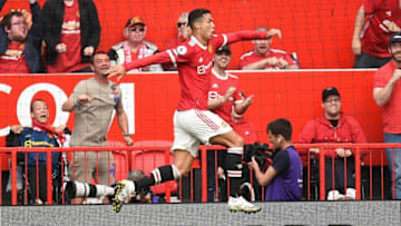 Manchester United's Portuguese striker Cristiano Ronaldo celebrates after scoring the opening goal of the English Premier League football match between Manchester United and Newcastle at Old Trafford in Manchester, north west England, on September 11, 2021. - RESTRICTED TO EDITORIAL USE. No use with unauthorized audio, video, data, fixture lists, club/league logos or 'live' services. Online in-match use limited to 120 images. An additional 40 images may be used in extra time. No video emulation. Social media in-match use limited to 120 images. An additional 40 images may be used in extra time. No use in betting publications, games or single club/league/player publications. (Photo by Oli SCARFF / AFP) / RESTRICTED TO EDITORIAL USE. No use with unauthorized audio, video, data, fixture lists, club/league logos or 'live' services. Online in-match use limited to 120 images. An additional 40 images may be used in extra time. No video emulation. Social media in-match use limited to 120 images. An additional 40 images may be used in extra time. No use in betting publications, games or single club/league/player publications. / RESTRICTED TO EDITORIAL USE. No use with unauthorized audio, video, data, fixture lists, club/league logos or 'live' services. Online in-match use limited to 120 images. An additional 40 images may be used in extra time. No video emulation. Social media in-match use limited to 120 images. An additional 40 images may be used in extra time. No use in betting publications, games or single club/league/player publications. (Photo by OLI SCARFF/AFP via Getty Images)