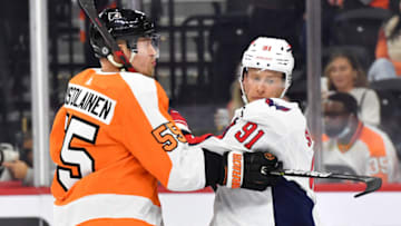 Sep 28, 2022; Philadelphia, Pennsylvania, USA; Philadelphia Flyers defenseman Rasmus Ristolainen (55) and Washington Capitals center Joe Snively (91) battle for position during the first period at Wells Fargo Center. Mandatory Credit: Eric Hartline-USA TODAY Sports