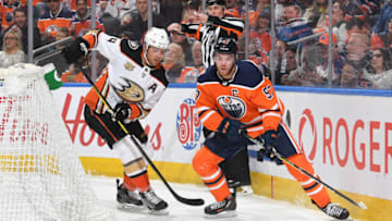 EDMONTON, AB - MARCH 30: Connor McDavid #97 of the Edmonton Oilers skates with the puck while being pursued by Cam Fowler #4 of the Anaheim Ducks on March 30, 2019 at Rogers Place in Edmonton, Alberta, Canada. (Photo by Andy Devlin/NHLI via Getty Images)