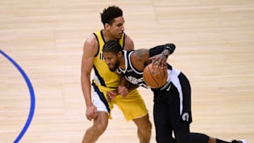 LOS ANGELES, CALIFORNIA - JANUARY 17: Paul George #3 of the LA Clippers keeps his dribble in front of Malcolm Brogdon #7 of the Indiana Pacers during the first half at Staples Center on January 17, 2021 in Los Angeles, California. (Photo by Harry How/Getty Images) NOTE TO USER: User expressly acknowledges and agrees that, by downloading and/or using this Photograph, user is consenting to the terms and conditions of the Getty Images License Agreement. Mandatory Copyright Notice: Copyright 2021 NBAE