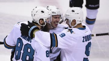 Mar 29, 2016; Vancouver, British Columbia, CAN; San Jose Sharks forward Logan Couture (39) celebrates with teammates after scoring a empty net goal during the third period against the Vancouver Canucks at Rogers Arena. The Sharks won 4-1. Mandatory Credit: Anne-Marie Sorvin-USA TODAY Sports