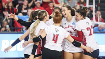 Louisville celebrates a point in the first match as the Cards take Samford in the first round of the 2022 NCAA Volleyball tournament Friday night at L&N Credit Union Arena. The Cards won the match 3-0. Dec. 2, 2022Uoflvball 28