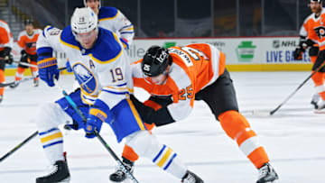 PHILADELPHIA, PA - JANUARY 19: Jake McCabe #19 of the Buffalo Sabres is pressured by James van Riemsdyk #25 of the Philadelphia Flyers in the first period at Wells Fargo Center on January 19, 2021 in Philadelphia, Pennsylvania. (Photo by Drew Hallowell/Getty Images)
