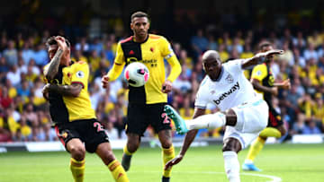 WATFORD, ENGLAND - AUGUST 24: Angelo Ogbonna of West Ham United kicks the ball as Jose Holebas of Watford protects his face during the Premier League match between Watford FC and West Ham United at Vicarage Road on August 24, 2019 in Watford, United Kingdom. (Photo by Alex Broadway/Getty Images)