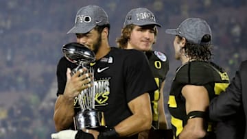 PASADENA, CALIFORNIA - JANUARY 01: Troy Dye #35 of the Oregon Ducks celebrates after defeating the Wisconsin Badgers in the Rose Bowl game presented by Northwestern Mutual at Rose Bowl on January 01, 2020 in Pasadena, California. (Photo by Kevork Djansezian/Getty Images)