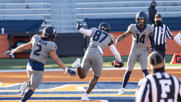 Dec 5, 2020; Champaign, Illinois, USA; Illinois Fighting Illini tight end Daniel Barker (87) celebrates his touchdown with punter Blake Hayes (14) and running back Chase Brown (2) during the first half at Memorial Stadium. Mandatory Credit: Patrick Gorski-USA TODAY Sports