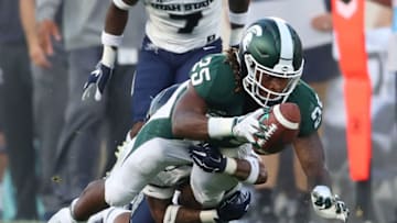 EAST LANSING, MI - AUGUST 31: Darrell Stewart Jr. #25 of the Michigan State Spartans dives for a first down in the first half while playing the Utah State Aggies at Spartan Stadium on August 31, 2018 in East Lansing, Michigan. (Photo by Gregory Shamus/Getty Images)