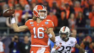 CHARLOTTE, NORTH CAROLINA - DECEMBER 07: Trevor Lawrence #16 of the Clemson Tigers drops back to pass against the Virginia Cavaliers during the ACC Football Championship game at Bank of America Stadium on December 07, 2019 in Charlotte, North Carolina. (Photo by Streeter Lecka/Getty Images)
